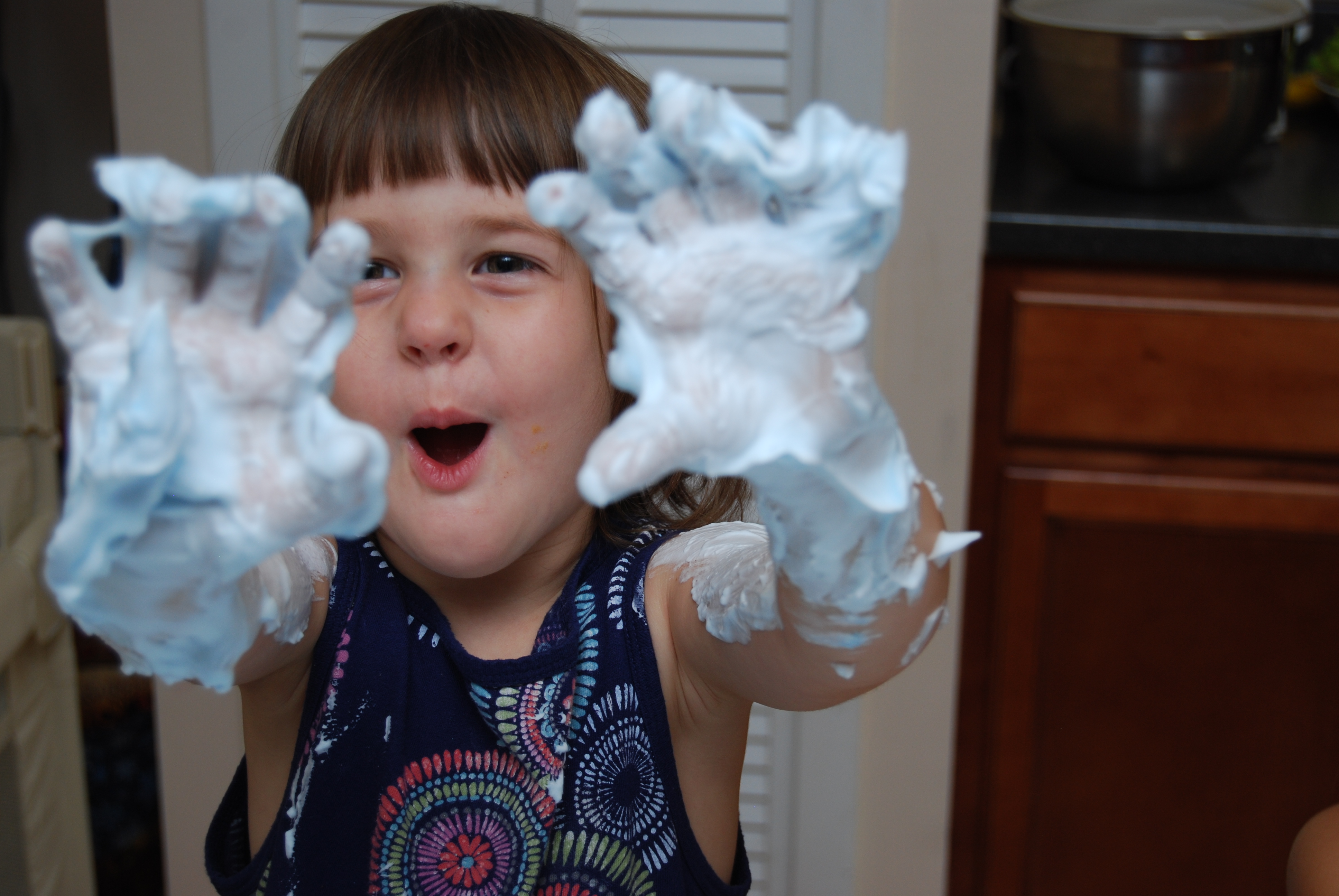 little girls playing in shaving cream